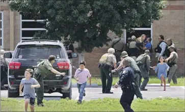  ?? Pete Luna Uvalde Leader-News ?? CHILDREN run during the shooting in Uvalde, Texas. After Uvalde, Democrats led the enactment of bipartisan gun safety reforms, one of the party’s “overwhelmi­ng policy successes,” an advisor on Latino outreach says.