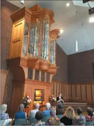  ?? RICHARD PAYERCHIN — THE MORNING JOURNAL ?? Organist Katelyn Emerson addresses the audience at First Lutheran Church, where she played in the dedication recital of the church’s new organ on Aug. 25.