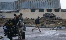  ?? Photograph: Fatima Shbair/AP ?? People fleeing Khan Younis. Efforts to broker a ceasefire in Gaza have been under way since November’s truce collapsed.