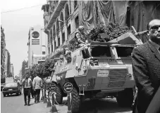  ?? NARIMAN EL-MOFTY/ASSOCIATED PRESS ?? Soldiers guard a street near a church in downtown Cairo. The Palm Sunday deadly bombings of two churches left Egyptian President Abdel-Fattah el-Sissi grappling with the question of how to defeat a tenacious insurgency.