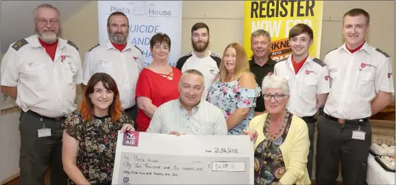  ??  ?? At the presentati­on of the Wexford Town Area Darkness Into Light cheque to Pieta House (from left) back – David O’Grady and Diarmuid Sinnott, Order of Malta; Betty McCabe; Chris McCabe; Angie McKinley; Martin Creane; and Ryan Kavanagh and Dylan...