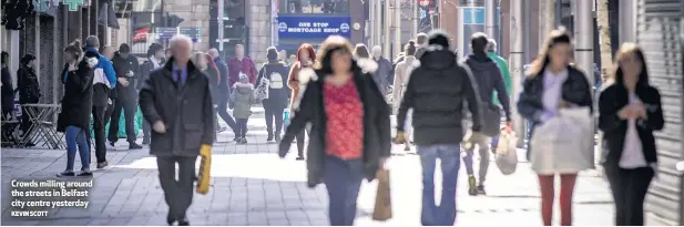  ?? KEVIN SCOTT ?? Crowds milling around the streets in Belfast city centre yesterday