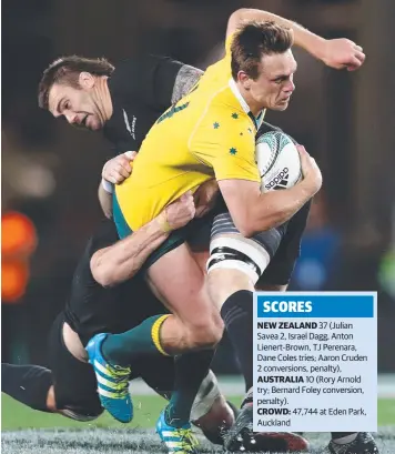  ?? Picture: PHIL WALTER/GETTY IMAGES) ?? Dane Haylett-Petty of the Wallabies tries to break free from the All Blacks double tackle including Liam Squire during the Bledisloe Cup match in Auckland yesterday