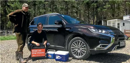  ?? ROB MAETZIG/STUFF ?? Kiwi expert Sid Marsh and Experience Pu¯ rangi ranger Jayden Fabish alongside the Outlander PHEV with the kiwi eggs and the chick, all packed up and ready to go.