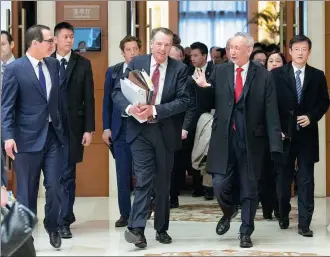  ?? SHEN HONG / XINHUA ?? Vice-Premier Liu He, US Trade Representa­tive Robert Lighthizer (center front) and US Treasury Secretary Steven Mnuchin (left) walk out of venue that was host to a new round of high-level economic and trade consultati­ons in Beijing on Thursday.