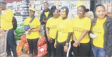  ?? ?? MTN staff inside the supermarke­t after watching the trolley dash event.