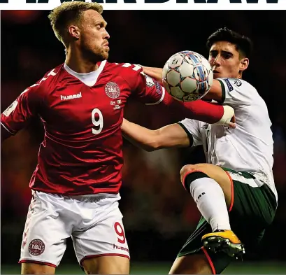  ??  ?? HONOURS EVEN: Denmark forward Nicolas Jorgensen vies for possession with Ireland’s Callum O’Dowda.