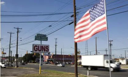 ?? ?? A sign indicates Nagel's Gun Shop, in San Antonion, Texas, near the 2,000 miles long U.S.-Mexico border. Photograph: Gilles Mingasson/ Getty Images