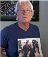  ?? AP ?? William Owens holds a photo of his son ‘Ryan’ Owens. —
