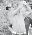  ??  ?? St. Catharines Golf and Country Club member Robbie Ellis follows the flight of his tee shot at the Champion of Champions tournament Saturday at Rockway Vineyards.