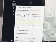  ??  ?? In this December 7, 2015 file photo, Associated Press technology writer Brandon Bailey uses the Cortana digital assistant to get the weather forecast in San Francisco.