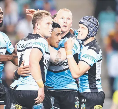  ?? CLASS ACT: Sharks fullback Valentine Holmes celebrates with teammates after scoring a try during last night’s semi- final. ??