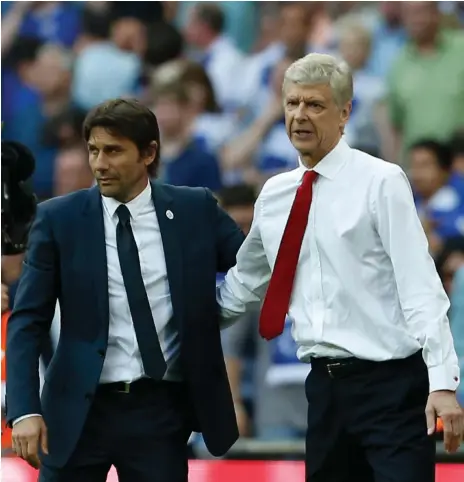  ?? AFP ?? Arsenal manager Arsene Wenger, right, will roll out a tweaked 3-4-2-1 formation against Chelsea in the FA Community Shield final today, a shape Antonio Conte and his team are familiar with having employed it to win the 2016/17 Premier League title