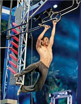  ?? [PHOTO BY BRANDON HICKMAN, G4] ?? A competitor races through the “American Ninja Warrior” obstacle course during 2012 regional qualifying competitio­ns in Venice, California.