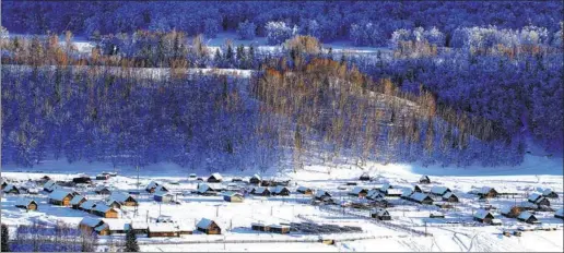  ?? PHOTOS PROVIDED TO CHINA DAILY ?? Hemu town in Altay in the north of China’s Xinjiang Uygur autonomous region is dotted with wooden cabins. The settlement hosts an internatio­nal ice and snow festival, featuring 50 events.