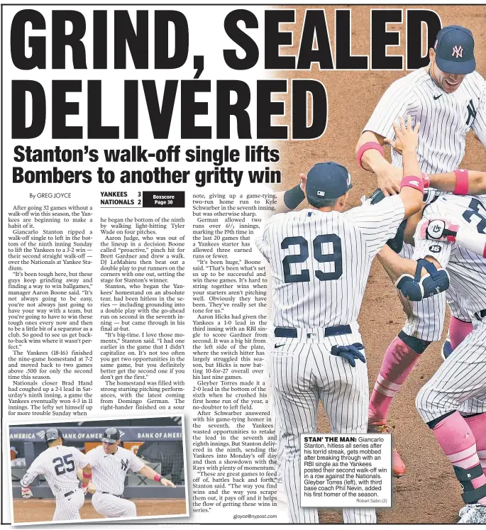  ?? Robert Sabo (2) ?? STAN’ THE MAN: Giancarlo Stanton, hitless all series after his torrid streak, gets mobbed after breaking through with an RBI single as the Yankees posted their second walk-off win in a row against the Nationals. Gleyber Torres (left), with third base coach Phil Nevin, added his first homer of the season.