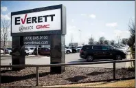  ?? NWA Democrat-Gazette/CHARLIE KAIJO ?? New cars fill the lot Monday at Everett Buick GMC in Bentonvill­e. RML Automotive NWA closed on a deal Monday to purchase the dealership and Everett’s Chevrolet dealership and Dodge, Jeep, Ram and Fiat dealership, both in Springdale.