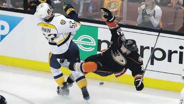  ?? CHRIS CARLSON/THE ASSOCIATED PRESS ?? Nashville Predators defenceman Matt Irwin, left, collides with Anaheim Ducks forward Chris Wagner in Game 2 on Sunday in Anaheim, Calif.