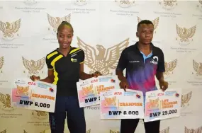  ?? ?? CASHING IN ... Table Tennis champions Tshepiso Rabatene ( L) and Bakang Moloka each walked away with P31000 after the season closing Phoenix Independen­ce tournament