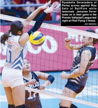  ?? JOEY MENDOZA ?? Rysabelle Devanadera of Perlas scores against Risa Sato of BaliPure while teammate Jamanea Ferrer looks on in their game in the Premier Volleyball League last night at Filoil Flying V Arena.