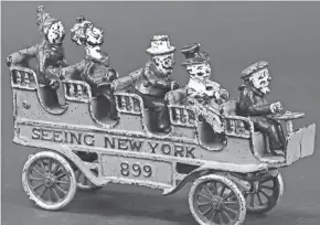  ?? HANDOUT ?? This toy tourist bus was made about 1910 by the Kenton Hardware Co. in Ohio. Not all of the passengers were part of the original toy, but suitable replacemen­ts had been found. It is a rare toy, so rare it auctioned for a little over $1,000.