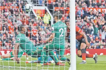  ??  ?? Manchester United’s Anthony Martial scores their second goal. — Reuters photo