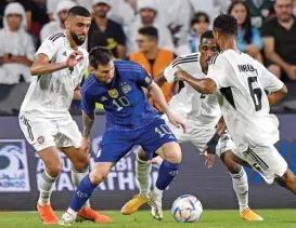  ?? ?? Argentina's Lionel Messi makes his way through tight UAE marking during their friendly match at Mohammed Bin Zayed Stadium in Abu Dhabi on Wednesday