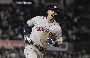  ?? FRANK FRANKLIN — ASSOCIATED PRESS ?? Houston Astros shortstop Carlos Correa reacts as he rounds the bases after hitting a three-run home run against the Yankees on Thursday night in New York. The Astros led 8-3 in Game 4 of the ALCS at the deadline for this newspaper.