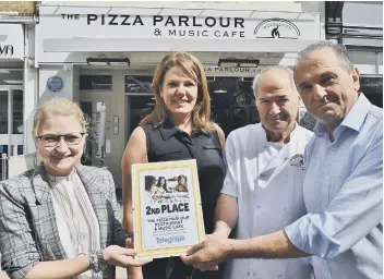  ??  ?? The Pizza Parlour team with their Restaurant of the Year runners-up certificat­e – Jessica Lewis, Sarah Barker, chef Nino Negro and Peter Fierro.