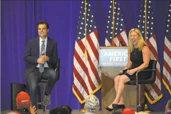  ?? Phelan M. Ebenhack / Associated Press ?? GOP Reps. Matt Gaetz and Marjorie Taylor Greene hold a rally May 7 in The Villages, Fla. House Speaker Nancy Pelosi recently assailed Greene’s behavior as “beyond the pale.”