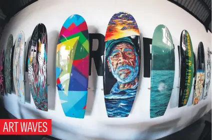  ?? Picture: EPA-EFE ?? Surfboards painted by various artists exhibited ahead of today’s Wavescapes Art Board charity auction in Cape Town.