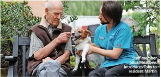  ?? ?? Staff member Silus Meadows introduces Toby to resident Martin