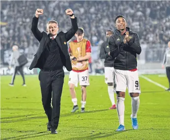  ??  ?? LEFT
Manchester United manager Ole Gunnar Solskjaer, left, and striker Anthony Martial celebrate their win against Partizan Belgrade.