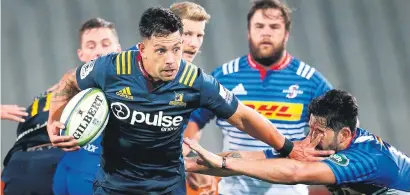  ?? Picture: AFP ?? JUGGERNAUT. Rob Thompson of the Highlander­s breaks through the tackle of EW Viljoen of the Stormers to score a try during their Super Rugby match in Dunedin yesterday.