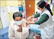  ?? ANI ?? A beneficiar­y being administer­ed vaccine against Covid-19 at a local health centre in New Delhi on Thursday.