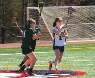  ?? Photo by Ernest A. Brown ?? Lincoln senior midfielder Leila Loparto (2, above) scored four goals and her sister, sophomore Lily Loparto, added five to lead the Lions to a 15-10 victory over visiting Chariho Friday morning.