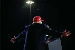  ?? (The New York Times/Doug Mills) ?? President Donald Trump addresses the crowd at a rally Wednesday evening at the airport in Des Moines, Iowa.