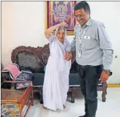  ??  ?? Subhadra Upadhyay, 88, gets ready for a walk with Piyush Vayeda. HT PHOTOS