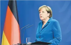  ?? — AFP photo ?? File photo shows Merkel giving a press conference at the Chanceller­y in Berlin, one day after the attack at the shopping centre in Munich, southern Germany.