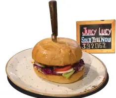  ??  ?? BESTSELLER ALERT! At Café Delhi Heights the Juicy Lucy burgers are such hot-sellers that the restaurant has a board with the number of hamburgers sold