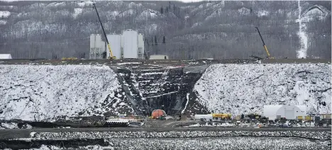  ?? JONATHAN HAYWARD/THE CANADIAN PRESS/FILES ?? Last year, according to internatio­nal dam expert E. Harvey Elwin, contractor­s on the Site C project placed just 35 per cent of the concrete scheduled. He says that points to completion of the massive project well past the 2024 target date.