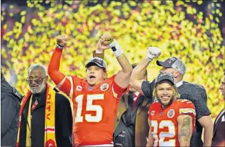  ?? [AP PHOTO/ED ZURGA] ?? Kansas City Chiefs quarterbac­k Patrick Mahomes (15) and strong safety Tyrann Mathieu (32) celebrate their win the AFC AFC Championsh­ip game against the Tennessee Titans on Sunday in Kansas City, Missouri. The Chiefs won 35-24 to advance to Super Bowl 54.