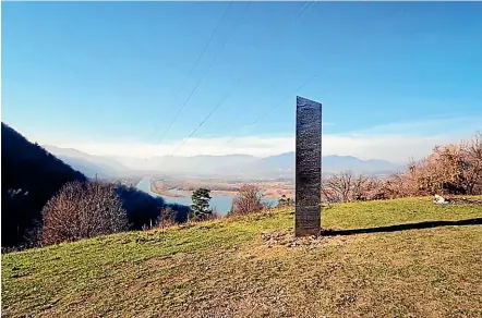  ?? AP ?? A metal pillar similar to the mysterious Utah desert monolith stands on the Batca Doamnei hill in northern Romania. Like the Utah structure, it vanished soon after attracting widespread interest.