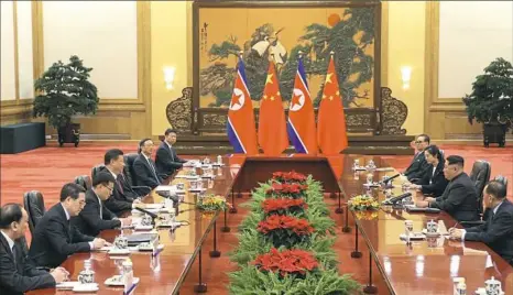  ??  ?? Chinese President Xi Jinping, fourth from left, and North Korean leader Kim Jong Un, second from right, meet at the Great Hall of the People in Beijing. The Chinese government confirmed Wednesday that North Korea’s reclusive leader went to Beijing and...