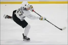  ?? Erik Verduzco Las Vegas Review-journal @Erik_verduzco ?? Ryder Donovan, shooting Wednesday at Golden Knights developmen­t camp at City National Arena, and former rival Michael Vorlicky have resolved their difference­s.