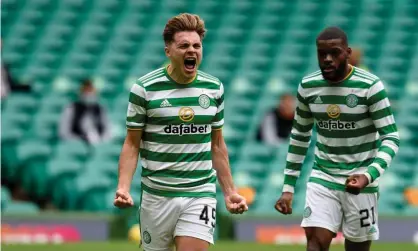  ??  ?? James Forrest celebrates setting Celtic on their way to victory. Photograph: Ian Rutherford/PA