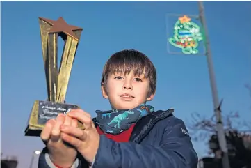  ?? ?? WINNER: Six-year-old Arlo Nicol designed a green dinosaur wearing a Christmas star.