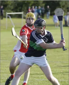  ??  ?? Matthew Traynor of Bray Emmets is tracked by Luke O’Reilly of Glenealy.