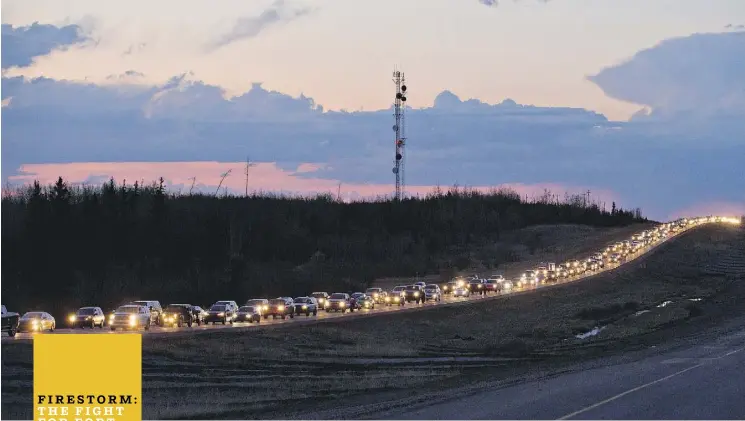  ?? THE CANADIAN PRESS ?? Traffic lined the four lanes of Highway 63 as residents fled Fort McMurray. In the early hours of the evacuation, officials realized there simply wasn’t enough road to get everybody out, so they sent some residents south to Edmonton and others north to...