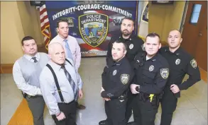  ?? Arnold Gold / Hearst Connecticu­t Media ?? Clockwise from far left, Capt. Carl V. Flemmig, Detective Sean Faughnan, Training Sgt. Scott Kleinknech­t, Officer Craig Thompson, Officer Paul Butler, Officer Scott Allard and Dep. Chief Joseph Perno at West Haven Police Department recently.